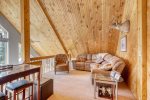 Knotty Pine Chalet loft with big screen TV.